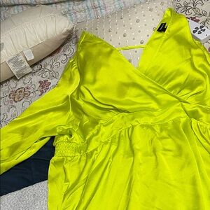 Plus size torrid size 3 which means 20/22. Vibrant Yellow Satin top.